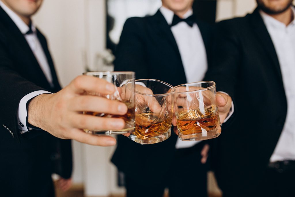 Group of people drinking whiskey